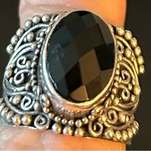Silver ring with black stone.  Size 6.5